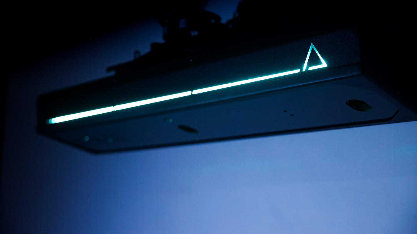 TruGolf APOGEE launch monitor with LED light strip showing overhead golf simulator tracking system