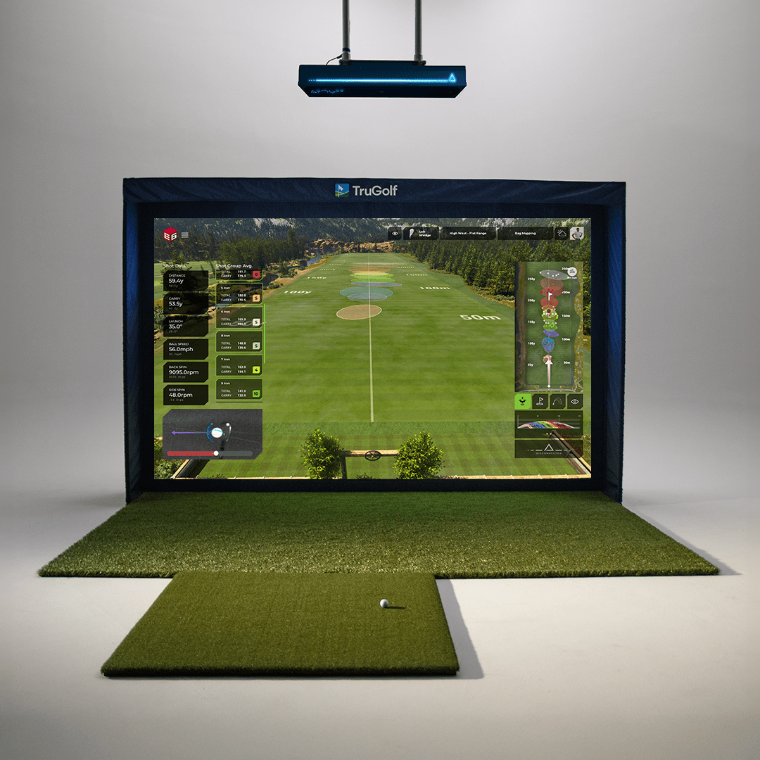 TruGolf golf simulator with the Apogee launch monitor displaying a virtual driving range, complete with hitting mat and ball ready for practice.